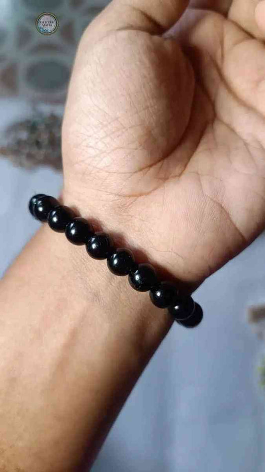 Glitter Mafia black bracelet with round beads worn on wrist for stylish everyday accessory