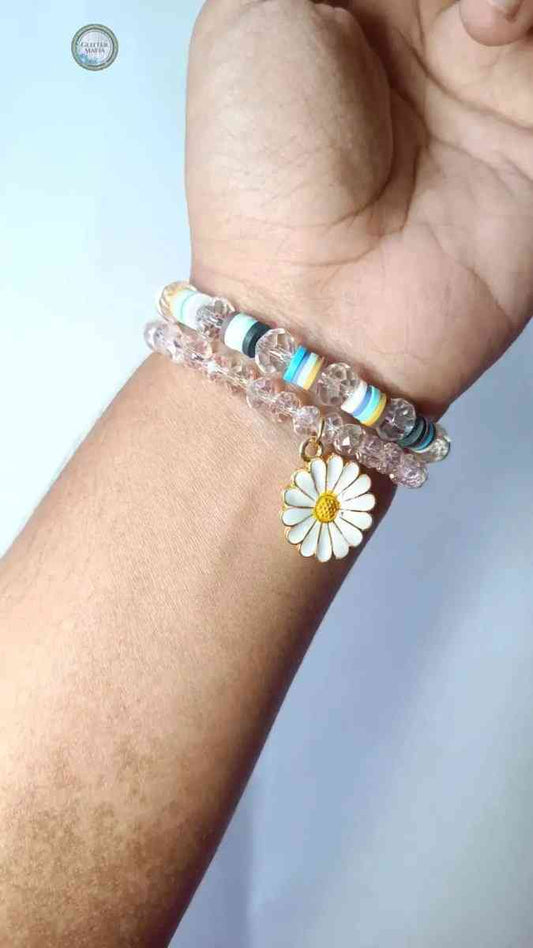 Glitter Mafia daisy charm bracelet with white and yellow flower charm on beaded wristband