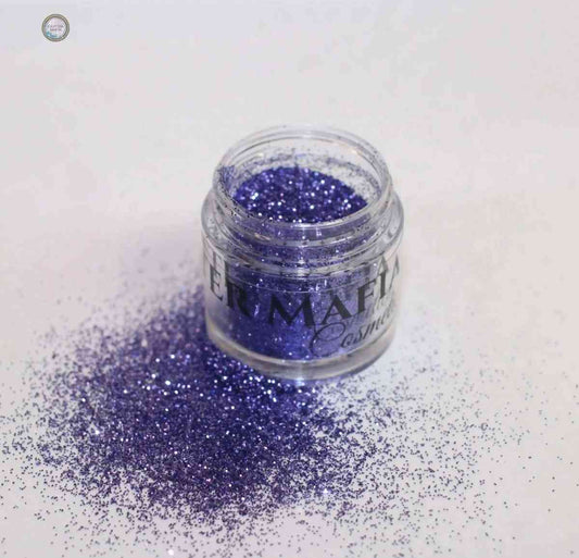 Glitter Mafia Aqua Escape Loose Glitter in vibrant purple shade with scattered sparkles