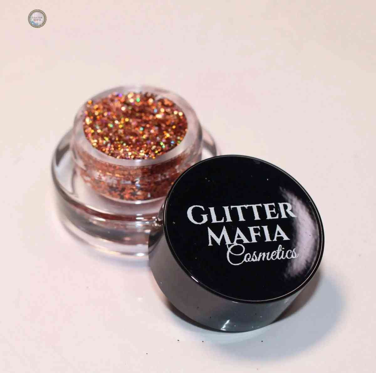 Glitter Mafia Fire Up Pressed Glitter in a small clear jar with black lid showing copper and gold sparkly glitter