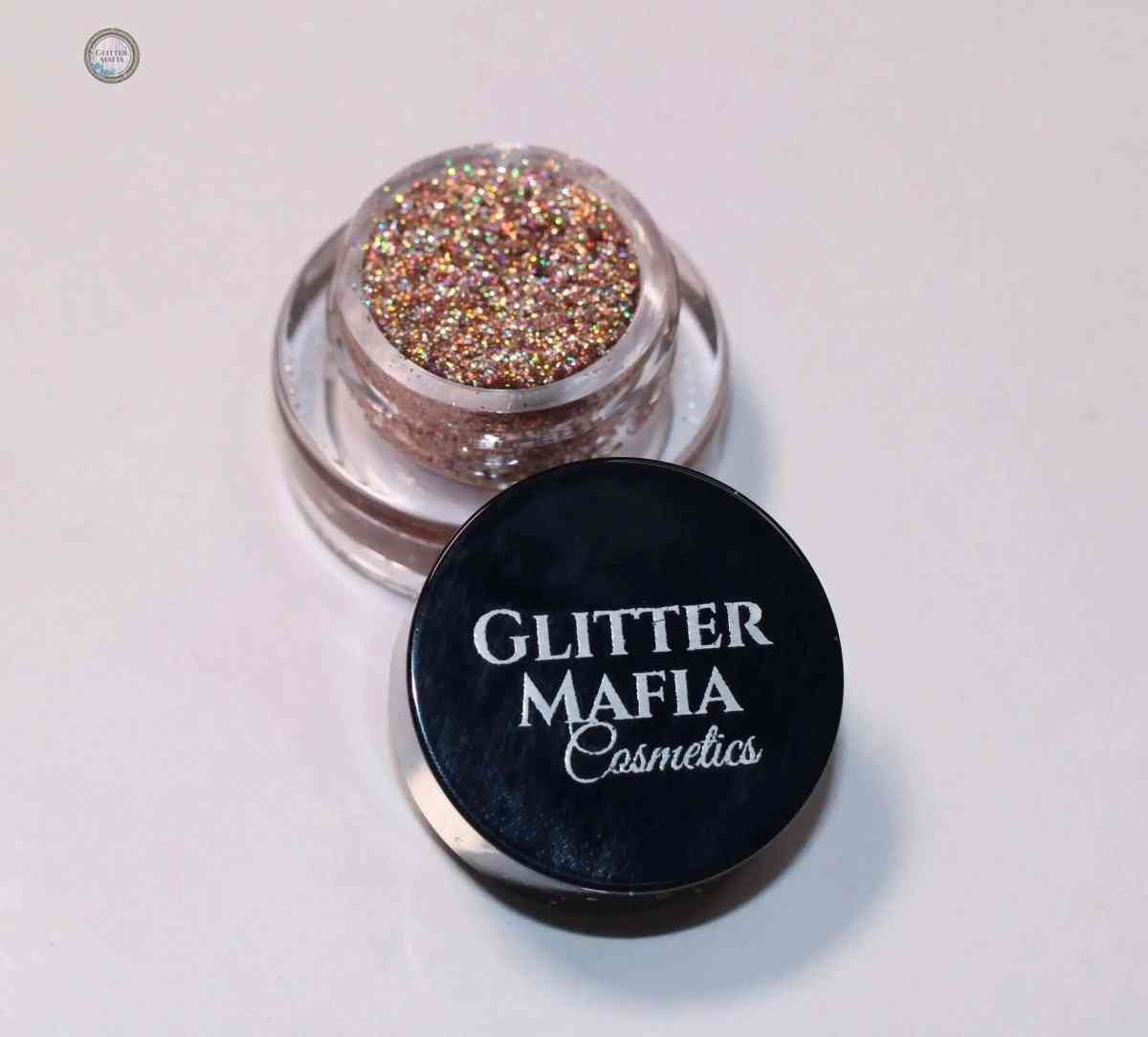 Midas Touch Mini Pressed Glitter by Glitter Mafia in a small clear container with black lid