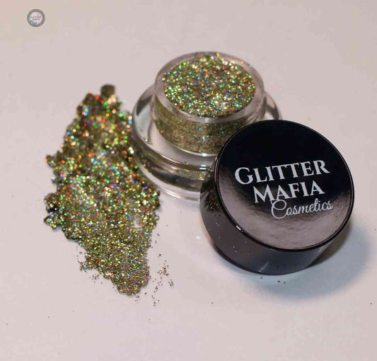 Glitter Mafia Luna Pressed Glitter in a small clear jar with black lid and sparkling gold shimmer