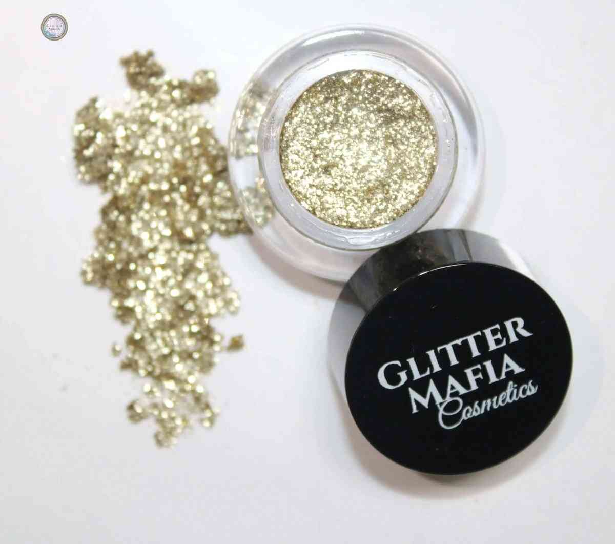Glitter Mafia Malibu Pressed Glitter mini jar with loose gold glitter on white background