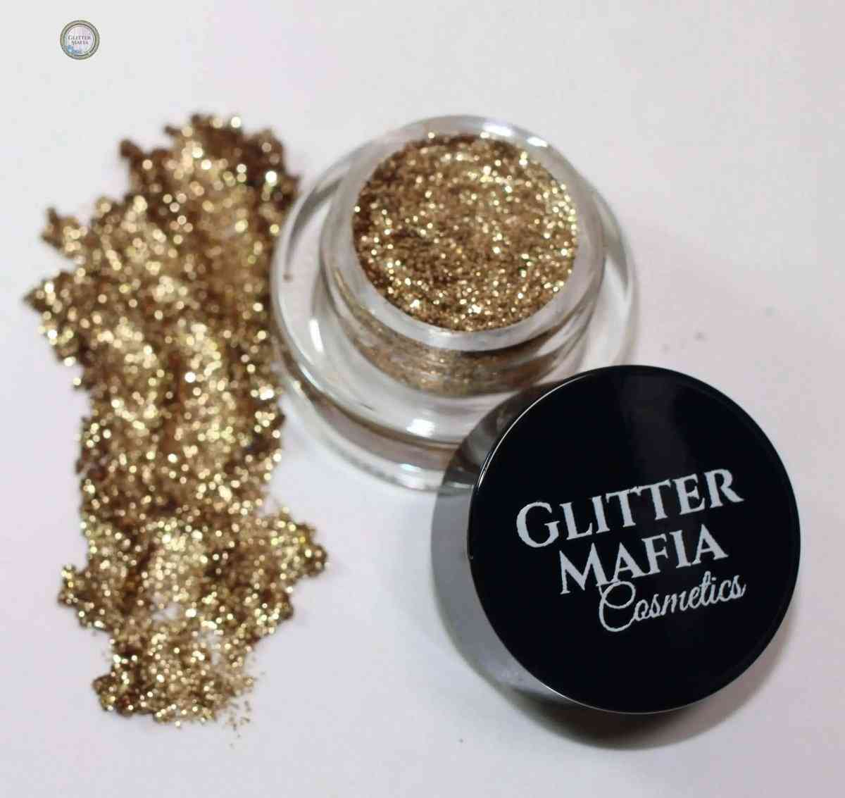 Glitter Mafia Nebula Pressed Glitter in a small pot with gold sparkling glitter swatch