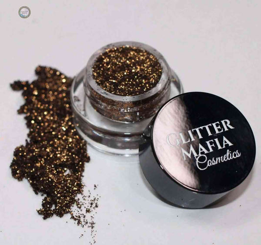 Glitter Mafia Cappuccino Pressed Glitter mini jar with spilled brown and gold shimmer glitter
