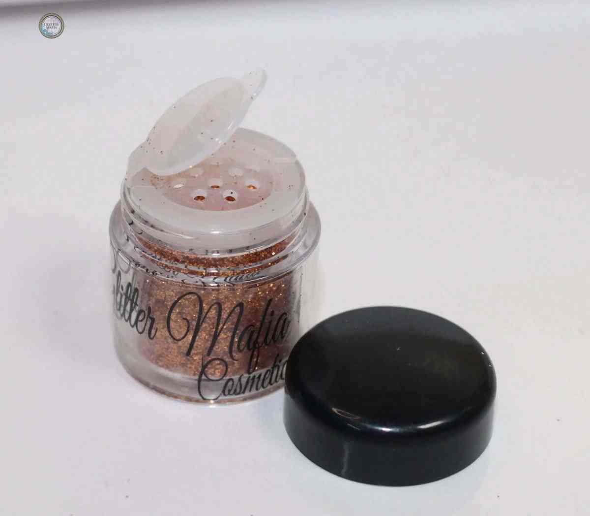 Glitter Mafia Marigold Pressed Glitter in small container with black lid on white background