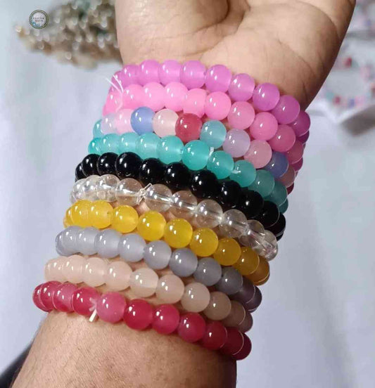 Colorful set of 10 piece bracelet by Glitter Mafia featuring round beads in multiple vibrant colors