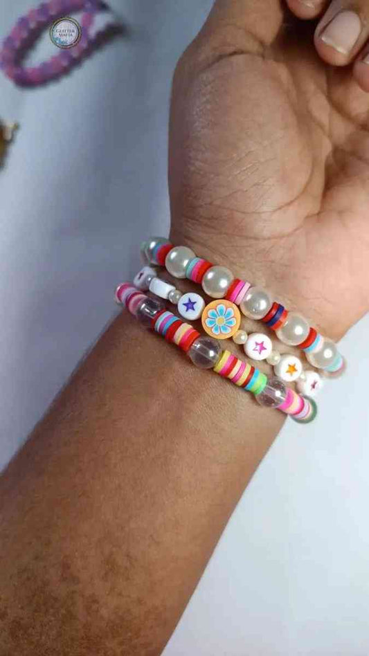 Glitter Mafia colorful set of 3 bracelet with beads pearls and flower star charms on wrist