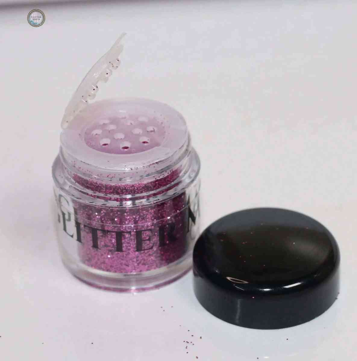 Glitter Mafia 24k Gold Benny Loose Glitter in clear jar with black lid open showing pink glitter
