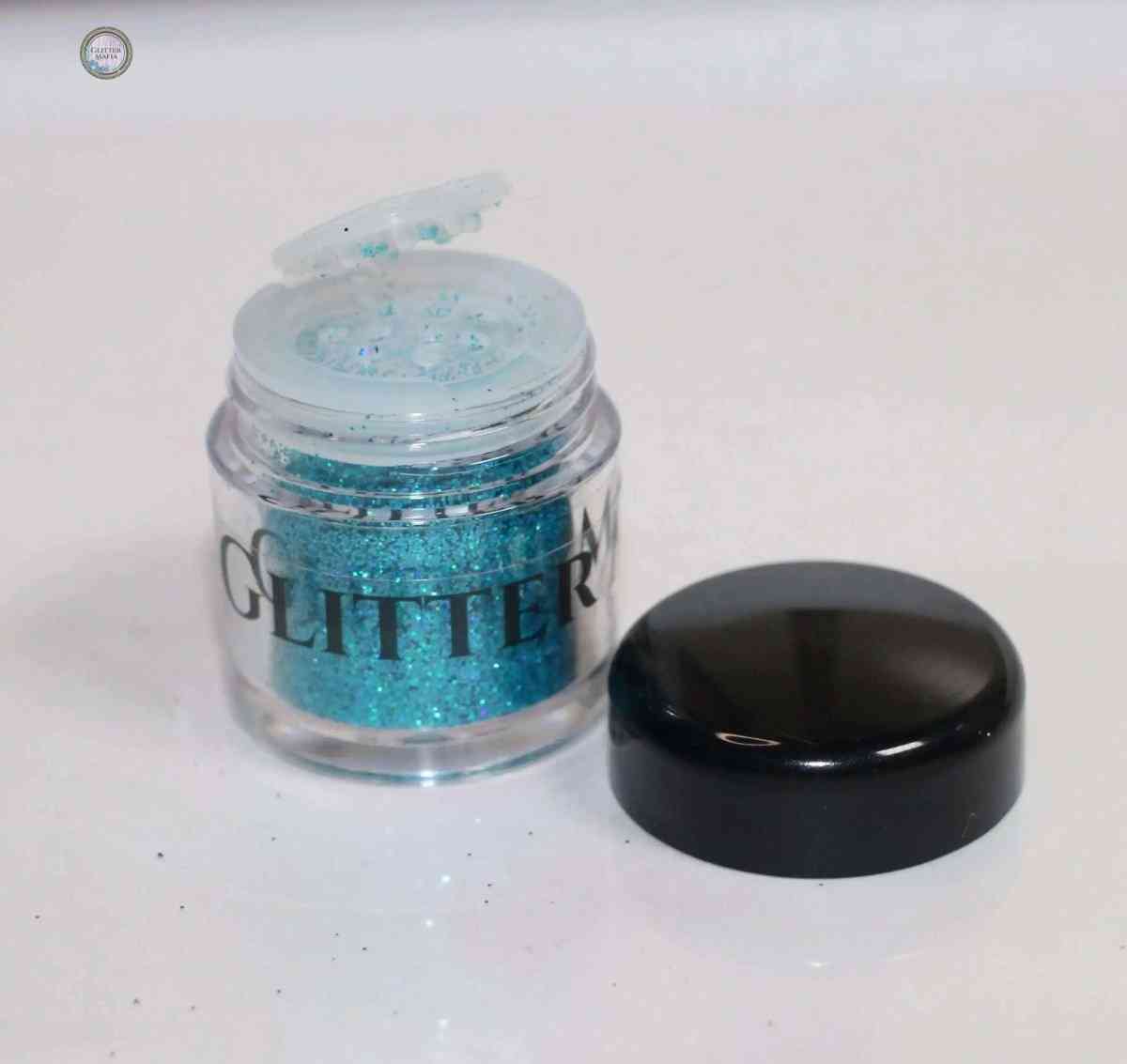 Glitter Mafia Blaze Holographic Loose Glitter in vibrant azure shade open jar with black lid