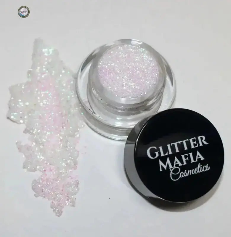 Glitter Mafia Cosmetics iridescent loose glitter jar with spilled glitter from Beginner's Kit