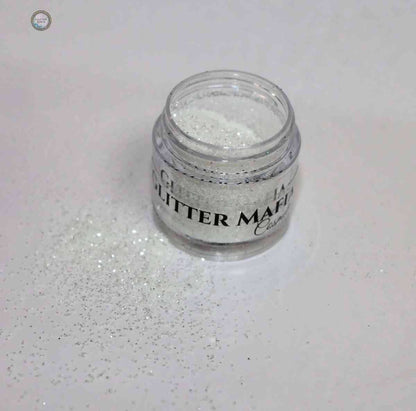 Glitter Mafia jar of Diamond Loose Glitter with sparkling white glitter spilled on white surface