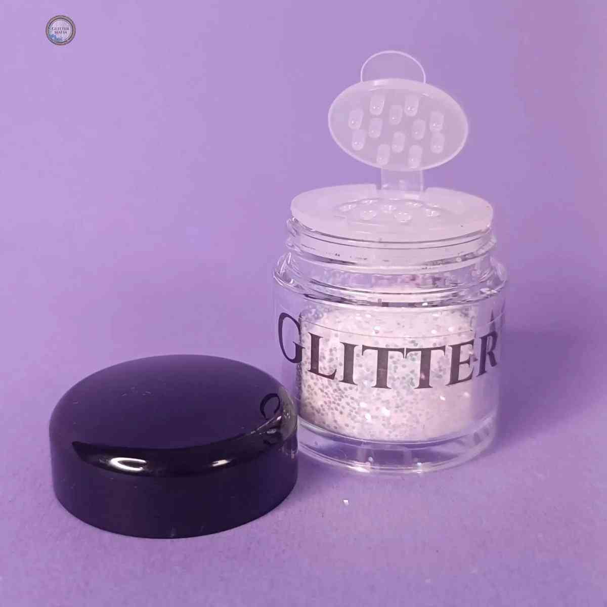 Glitter Mafia Stella Chrome Glitter in clear jar with black lid on purple background